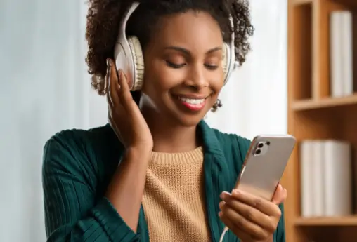 A woman listening to an audio book