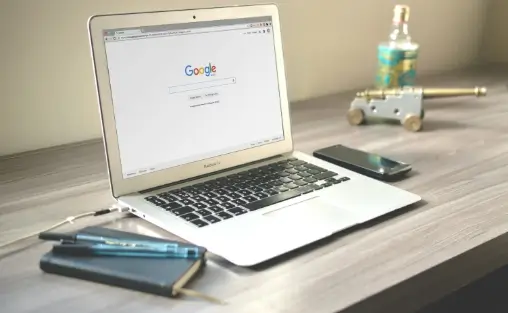 search engine optimization using a laptop on a table